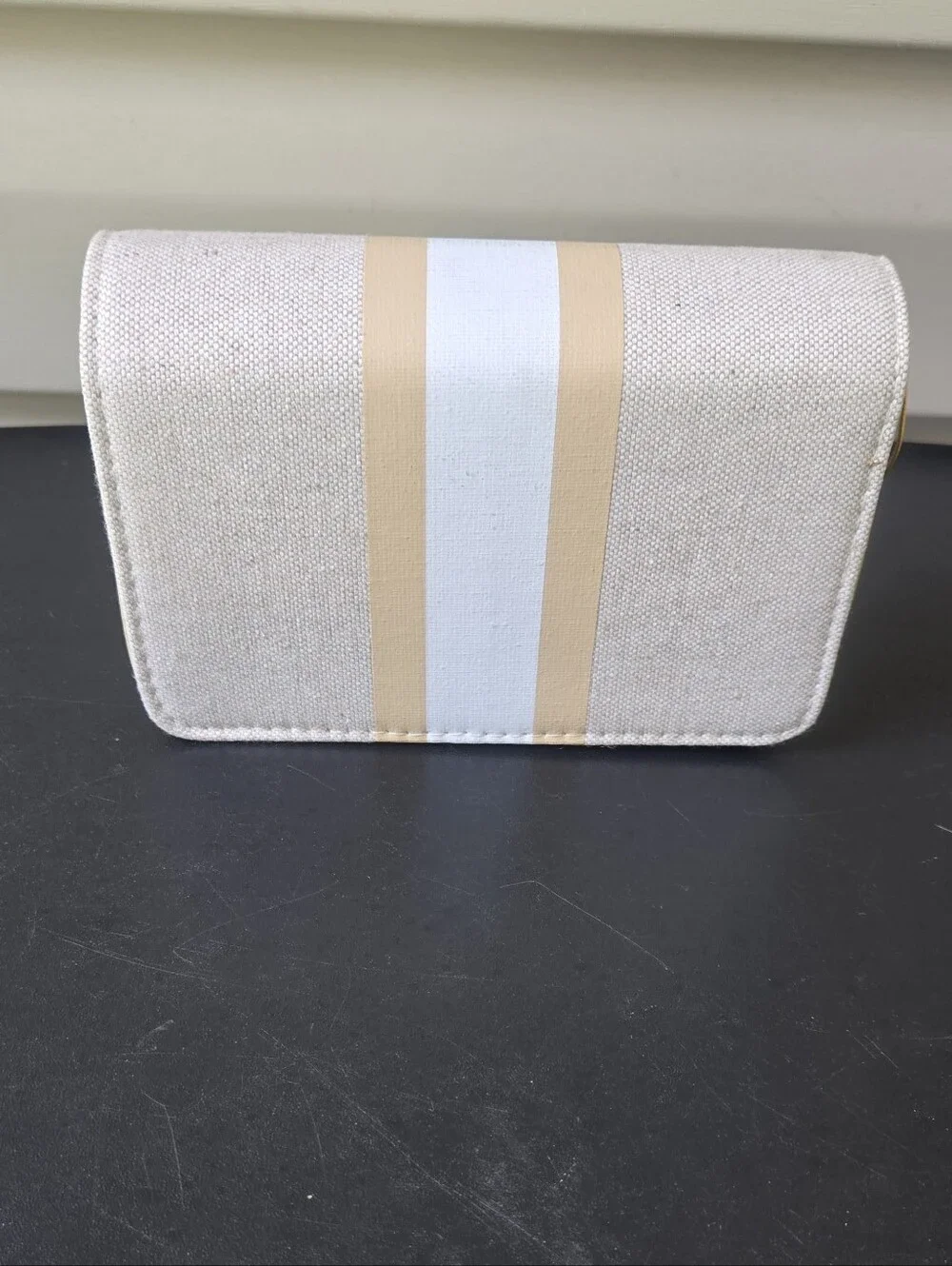 bebe Almond Canvas Crossbody Bag with Gold-Trim Stripe